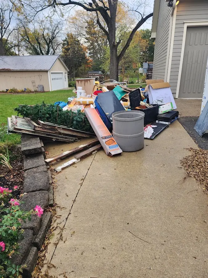 Dumpster being loaded with debris for Estate Cleanout Dumpster Rental in Hagerstown